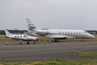 N123GV @ EGHH - Parked at Signatures - with N10522 - by John Coates