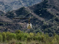 N4512G @ SZP - 2010 Robinson R66, one Rolls Royce 250-C300/A1 turboshaft derated to 270 shp for takeoff, 224 shp max continuous, 5 seats, Experimental class R&D, departing SZP helipad for river route - by Doug Robertson