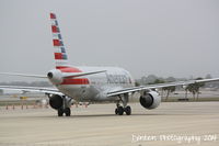 N700UW @ KSRQ - US Air Flight 2090 (N700UW) prepares for flight at Sarasota-Bradenton International Airport - by Donten Photography