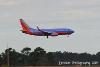N414WN @ KMCO - Southwest Flight 639 (N414WN) arrives at Orlando International Airport following a flight from Nashville International Airport - by Donten Photography