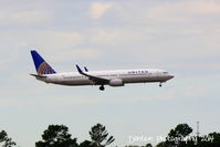N38424 @ KMCO - United Flight 1294 (N38424) arrives at Orlando International Airport following a flight from Houston Bush Intercontinental Airport - by Donten Photography