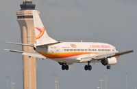 PZ-TCO @ KMIA - Surinam B733 in front of MIA control tower. - by FerryPNL