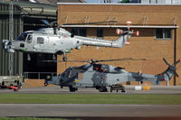 XZ732 @ EGDY - Comparative shot of XZ732/673 (702 NAS) and Wildcat AH1 ZZ392 of 652 Sqn AAC. - by Howard J Curtis