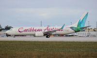 9Y-POS @ MIA - Caribbean 737-800 - by Florida Metal