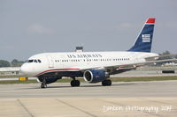 N711UW @ KSRQ - US Air Flight 2015 (N711UW) arrives at Sarasota-Bradenton International Airport following a flight from Charlotte-Douglas International Airport - by Donten Photography