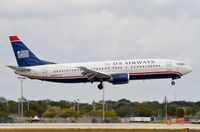 N409US @ KFLL - Classic US B734 landing - by FerryPNL