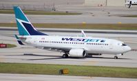 C-FEWJ @ FLL - West Jet 737-700 - by Florida Metal