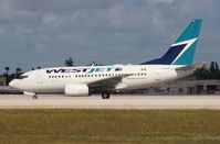 C-GWCY @ MIA - West Jet 737-600 - by Florida Metal