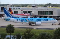 C-GWSZ @ MCO - West Jet La Garantie Qui Tient 737-800 recently painted over into the Disney plane - by Florida Metal