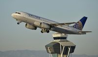 N410UA @ KLAX - Departing LAX on 25R - by Todd Royer