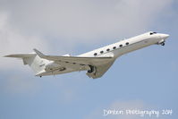 01-0030 @ KSRQ - C-37 Gulfstream V (01-0030) from MacDill Air Force Base performs a touch and go at Sarasota-Bradenton International Airport - by Donten Photography