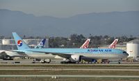 HL8216 @ KLAX - Taxiing to parking - by Todd Royer