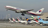 9M-MRD @ KLAX - Departing LAX on 25R - by Todd Royer
