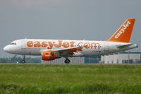 G-EZBF @ LFPG - Airbus A319-111, reverse thrust anding Rwy 26L, Roissy Charles De Gaulle Airport (LFPG-CDG) - by Yves-Q