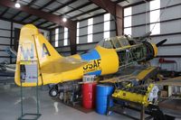 N455WA @ ISM - SNJ-6 being worked on at Warbird Adventures - by Florida Metal
