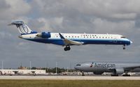 N518LR @ MIA - United Express CRJ-700 - by Florida Metal
