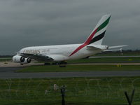 A6-EET @ EGCC - just taxing in to go onto its gate - by packo