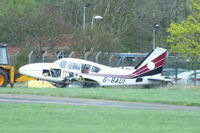 G-BAUI @ EGBJ - dumped on the edge of the airfield - by Chris Hall