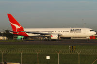 VH-OGI @ YSSY - taxiing from 34R - by Bill Mallinson