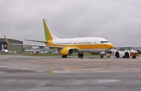 VQ-BBS @ EGHH - Being towed back to European apron from parking area - by John Coates