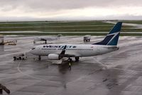 C-FWAD @ YVR - Rainy day departure - by metricbolt