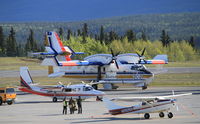 C-GHWF @ CYXY - On the ramp at Whitehorse, Yukon, en route to Alaska to help fight the Funny River fire. - by Murray Lundberg