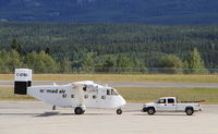 C-GTBU @ CYXY - Being towed back to the Nomad Air base at Whitehorse, Yukon. - by Murray Lundberg