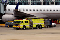 N18112 @ KORD - Fire truck passing by aircraft  O'Hare - by Ronald Barker