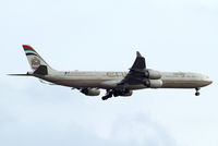 A6-EHH @ EGLL - Airbus A340-642 [870] (Etihad Airways) Home~G 01/08/2014. On approach 27L. Wears Abu Dhabi 2014 F1 Grand Prix titles. - by Ray Barber