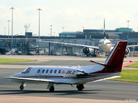 G-JBLZ @ EGCC - Taxy to the Manchester terminal skyline - by Clive Pattle