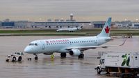 C-FNAN @ CYYZ - Air Canada Embraer 190 on a rainy early morning. - by M.L. Jacobs