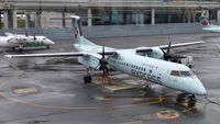 C-GGND @ CYYZ - Air Canada Express Dash 8 on a rainy morning. - by M.L. Jacobs