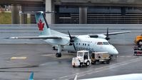 C-GANQ @ CYYZ - Air Canada Express Dash 8 recently arrived at the terminal. - by M.L. Jacobs