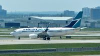 C-GWSH @ CYYZ - WestJet Boeing 737 taxiing out. - by M.L. Jacobs