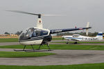 G-HBMW @ EGBR - Robinson R22 at the Real Aeroplane Club's Helicopter Fly-In, Breighton Airfield, North Yorkshire, September 21st 2014. - by Malcolm Clarke