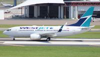 C-FWSO @ KTPA - West Jet 737-700 - by Florida Metal