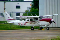 C-GTJN @ CYOW - Cessna T.206H Turbo Stationair [T206-08443] Ottawa-Macdonald Cartier International~C 18/06/2005.Taken through glass on coach whilst moving. - by Ray Barber