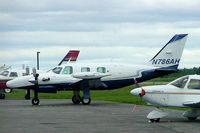 N786AH @ CYOW - Piper PA-31T Cheyenne II [31T-7820053] Ottawa-Macdonald Cartier International~C 18/06/2005.  Taken through glass on coach whilst moving. - by Ray Barber