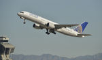 N543UA @ KLAX - Departing LAX on 25R - by Todd Royer