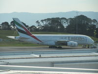 A6-EDA @ NZAA - on far apron - from top viewing gallery - by magnaman