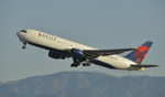 N143DA @ KLAX - Departing LAX on 25R - by Todd Royer