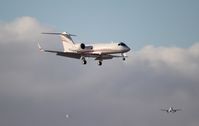 N117MS @ MIA - Gulfstream IV landing Runway 26L with aircraft on approach for 12 - by Florida Metal