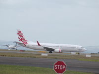 VH-YID @ NZAA - turning off runway - long shot and hot! - by magnaman