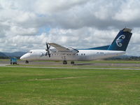 ZK-NFA @ NZTG - on apron near control tower - by magnaman