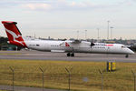 VH-QOS @ YSSY - taxiing from 34R - by Bill Mallinson