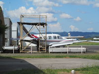 ZK-CAM @ NZAR - outside Christian Aviation hangar - new C206 VH-UBV is behind - by magnaman