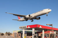 TC-JJH @ CYYZ - Short final for runway 23 at Toronto Pearson, over the iconic Petro Canada gas station on Airport Rd. - by BlindedByTheFlash