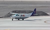 N930FE @ KLAS - Cessna 208B - by Mark Pasqualino