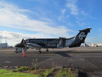 ZK-EAG @ NZAA - on domestic apron - taken from short term car park. Free parking for 15 mins and can pretty much touch some aircraft on close stands. - by magnaman