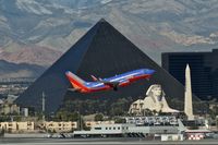 N201LV @ KLAS - Southwest Airlines, is here departing Las Vegas Int'l(KLAS), in front of the famous Luxor Hotel - by A. Gendorf